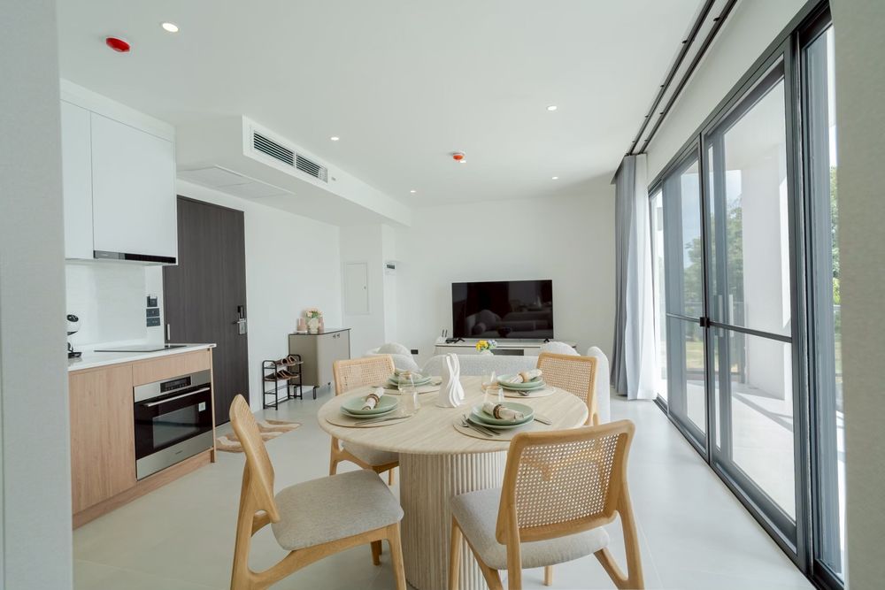 Garden-view living room with floor-to-ceiling glass